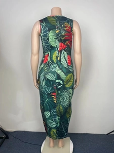 Rear view detail of a sleeveless maxi dress with vibrant tropical leaf and flower prints