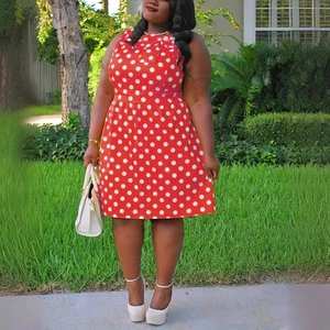 Vintage plus size red sleeveless dress with white polka dots and an A-line silhouette