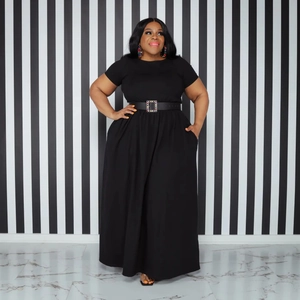 Detail of high waist black maxi dress with jeweled leather belt and flared A-line skirt