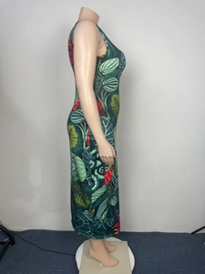Side view of tropical leaf print sleeveless maxi dress with vibrant green and red foliage