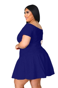 Detail of royal blue off-shoulder short sleeve dress with pleated skirt texture