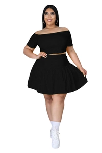 Detail of black off-shoulder crop top and pleated mini skirt set in plus size style
