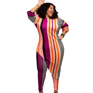 Detail view of plus size two-piece set with vibrant stripes and asymmetric tunic hemline