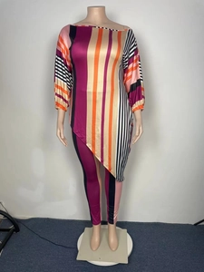 Detail of multi-color striped two-piece set with asymmetric hem and slim pants