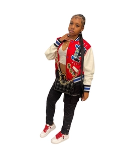 Detail of American retro baseball jacket featuring red-white contrast and letter embroidery