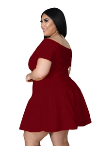 Close-up of the ribbed texture on the plus-size off-shoulder top and pleated skirt set