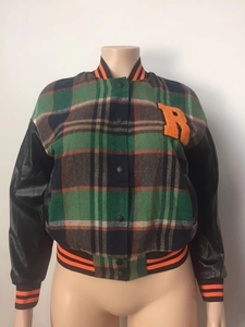 Detail of varsity jacket with orange chenille R patch and plaid wool fabric