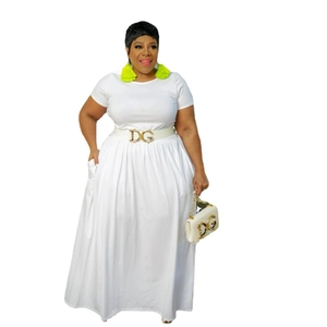 Detail showing the white short sleeve waist dress with gold DG buckle belt and matching bag