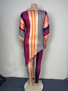 Rear view of plus size casual set showing asymmetric hem and vibrant striped texture