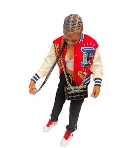 Full-body view of an oversized bomber jacket with letter embroidery and contrast ribbing
