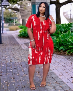 Detail view of the V-neck and red tie-dye print pattern on this stylish plus size dress
