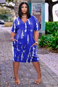 Close-up of a royal blue plus size V-neck dress featuring white tie-dye and side pockets