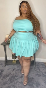Detail of light blue two-piece crop top and pleated mini skirt set for plus size women