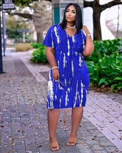 Detail of royal blue V-neck dress with white tie-dye vertical stripes in casual style