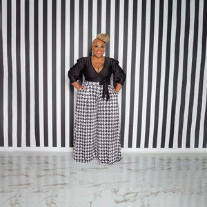 Women's houndstooth wide-leg pants and black V-neck puff sleeve top set in chic fashion