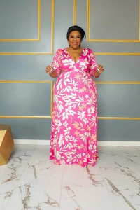 Close-up of pink floral plus size maxi dress featuring elegant V-neck and wrap design