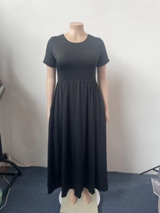 Detailed texture of black short sleeve maxi dress with elastic knitted fabric and high waist