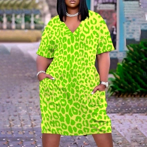 Close-up of neon green leopard print dress featuring V-neck and practical side pockets