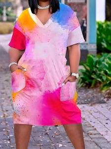 Detail of colorful watercolor print V-neck summer dress with functional front pockets