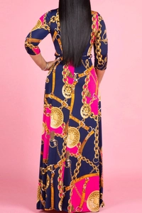 Detailed back view of a maxi dress featuring baroque gold chain and belt buckle prints
