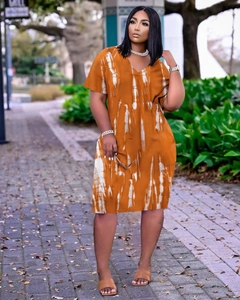 Detail of V-neck short sleeve dress with orange and white abstract tie-dye print