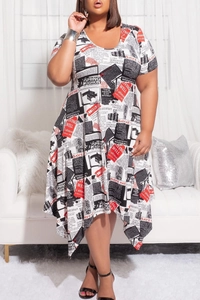 Detail of plus size short sleeve dress featuring newspaper print and asymmetric hem