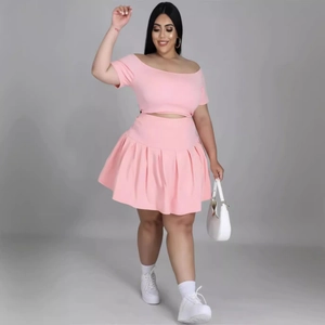 Pink plus size two-piece set featuring off-shoulder crop top and high waist pleated skirt