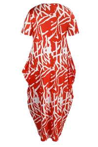 Detail of red and white abstract print on a loose short-sleeve summer maxi dress