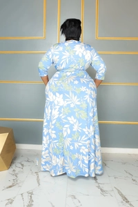 Back view of light blue floral maxi dress with waist belt and elegant flared skirt