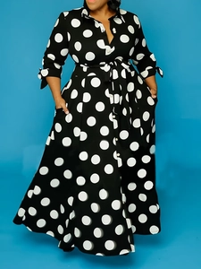 Women long sleeve polka dot shirt dress with collar and waist tie on blue background