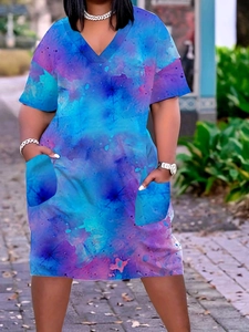 Detail of V-neck summer dress featuring blue abstract print and functional side pockets