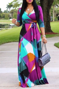 Detail of V-neck wrap dress with colorful geometric patterns and waist tie