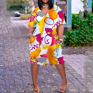 Women's V-neck short sleeve knee-length dress featuring vibrant abstract prints and pockets