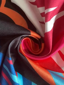 Macro detail of high-elasticity fabric with colorful geometric wave patterns and mesh texture