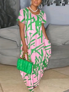 Detail of pink and green graffiti print maxi dress with short sleeves and round neck