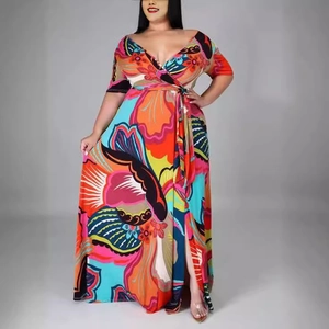 Plus size V-neck maxi dress featuring colorful tropical floral prints and side slit