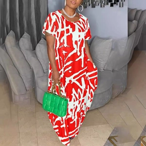 Chic red and white abstract print maxi dress with long sleeves and loose silhouette