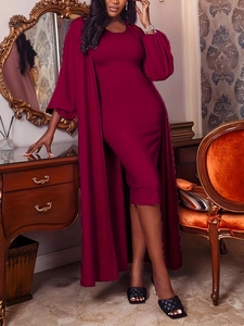 Elegant burgundy knit maxi dress and long cardigan set in a classical interior setting