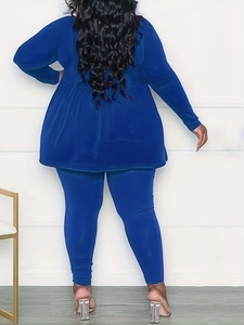 Rear view of dark blue two-piece set featuring long sleeve tunic and matching leggings