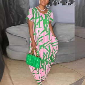 Summer short sleeve maxi dress with pink green abstract pattern and woven handbag