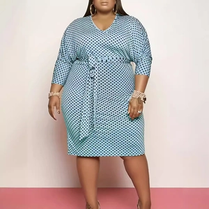 Light blue plus size V-neck dress with black polka dots and belted waist design