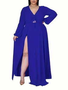 Detail of royal blue long sleeve maxi dress featuring a deep V-neck and high leg slit