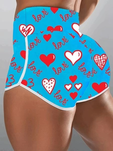 Detailed back view of high waist yoga shorts with blue love heart prints and white trim