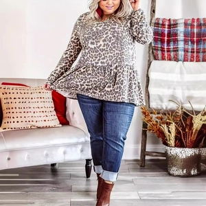 Plus size leopard print long sleeve top with flared cuffs and ruffle hem detail