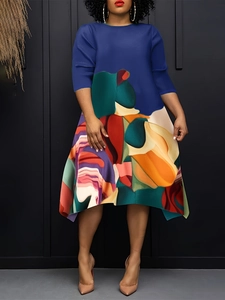 Women's royal blue long sleeve dress with colorful abstract print and asymmetrical hem