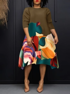 Women's plus size midi dress featuring olive green bodice and vibrant abstract print skirt