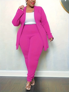 Detail of a bright rose pink three-piece business suit set with a V-neck vest and slim trousers