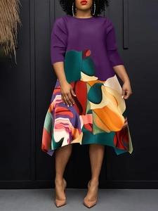 Detail of purple pleated bodice and colorful abstract print on a plus size maxi dress