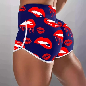 Women's high waist yoga shorts featuring red lip prints on dark blue fabric with white trim