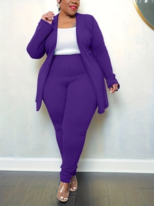 Detail of three-piece set featuring purple long cardigan, white tank top, and high waist pants